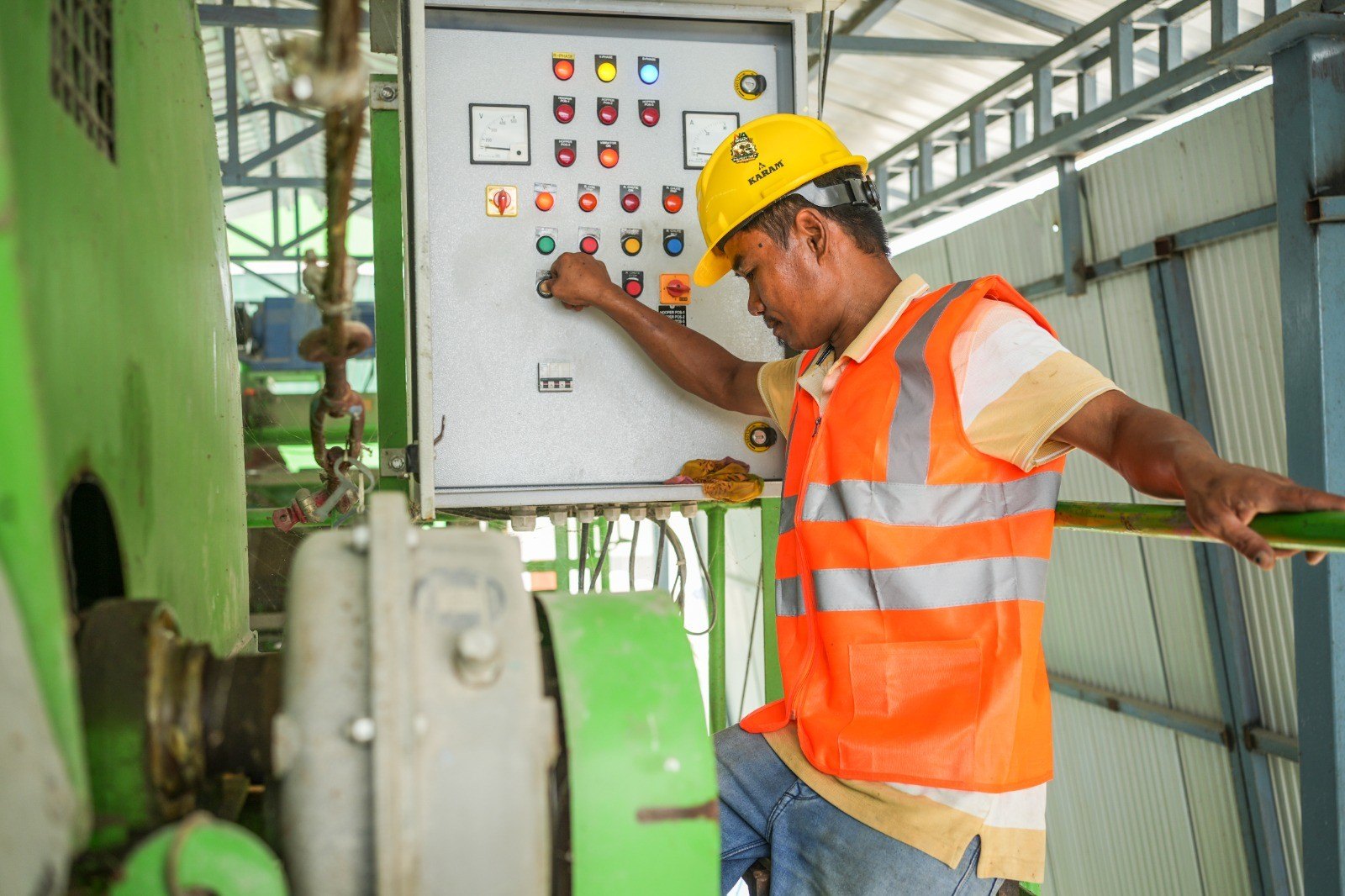 Plant operator setting a batch at the control panel